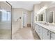 Spacious bathroom featuring double sinks, a shower, and a bathtub at 2050 Cambridge Springs Dr, Henderson, NV 89052