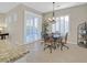 Charming breakfast nook with table and chairs near sliding doors at 2050 Cambridge Springs Dr, Henderson, NV 89052