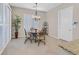 Bright breakfast nook with round table and four chairs at 2050 Cambridge Springs Dr, Henderson, NV 89052