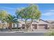 Single-story home with desert landscaping and two-car garage at 2050 Cambridge Springs Dr, Henderson, NV 89052