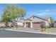 Two-story house with attached garage and mature trees at 2050 Cambridge Springs Dr, Henderson, NV 89052