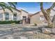 House exterior with gated entry and gravel landscaping at 2050 Cambridge Springs Dr, Henderson, NV 89052