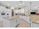 Bright kitchen with white cabinets, granite counters, and large island at 2050 Cambridge Springs Dr, Henderson, NV 89052