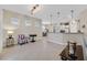 Open living room with tile floors and kitchen view at 2050 Cambridge Springs Dr, Henderson, NV 89052