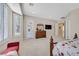 Main bedroom with large windows, plush carpet, and ensuite access at 2050 Cambridge Springs Dr, Henderson, NV 89052