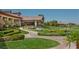 Clubhouse patio area with lush landscaping and walkway at 2050 Cambridge Springs Dr, Henderson, NV 89052