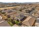 Aerial view of a house in a residential area with solar panels at 2124 Danzinger Pl, Henderson, NV 89044