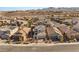 Aerial view of house and neighborhood in mountain setting at 2124 Danzinger Pl, Henderson, NV 89044