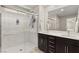 Double vanity bathroom with large shower and marble tile at 2124 Danzinger Pl, Henderson, NV 89044