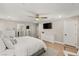 Main bedroom with large bed, dresser, and ensuite bathroom access at 2124 Danzinger Pl, Henderson, NV 89044