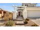 Two-story house with a pergola, brick walkway, and attached garage at 2124 Danzinger Pl, Henderson, NV 89044