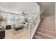 Living room with sectional sofa, hardwood floors and a staircase at 2124 Danzinger Pl, Henderson, NV 89044