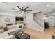 Open concept living area with a kitchen view and a staircase at 2124 Danzinger Pl, Henderson, NV 89044