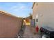 Side yard with brick pathway, landscaping, and storage shed at 2124 Danzinger Pl, Henderson, NV 89044