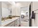 Double vanity bathroom with mosaic tile and a view of the upper floor at 2130 Maderno St, Henderson, NV 89044