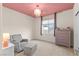 Bedroom with seating area and pink ceiling at 2130 Maderno St, Henderson, NV 89044