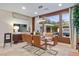 Modern dining room with glass table and leather chairs at 2130 Maderno St, Henderson, NV 89044