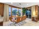 Elegant dining room with glass table and modern lighting at 2130 Maderno St, Henderson, NV 89044