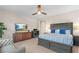 Main bedroom with large bed, TV, and plenty of storage at 2130 Maderno St, Henderson, NV 89044