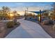 Community walkway with playground and shade structures at 2130 Maderno St, Henderson, NV 89044