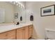 Light wood vanity, toilet and single sink at 2132 Timber Rose Dr, Las Vegas, NV 89134