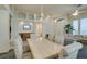 Bright dining room with chandelier and seating for six at 2132 Timber Rose Dr, Las Vegas, NV 89134