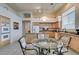 Kitchen features light wood cabinets, granite countertops, and island at 2132 Timber Rose Dr, Las Vegas, NV 89134