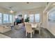 Bright living room features ample natural light, comfy seating, and a formal dining area at 2132 Timber Rose Dr, Las Vegas, NV 89134