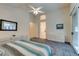 Main bedroom with sliding glass doors to the patio, a large bed, and plenty of dresser space at 2132 Timber Rose Dr, Las Vegas, NV 89134