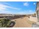 Cozy backyard with a mountain view, including a grill and chairs for entertaining and outdoor enjoyment at 2255 Potter Lake Ave, Henderson, NV 89052