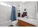 Well-lit bathroom with a shower/tub combination and neutral tile at 2255 Potter Lake Ave, Henderson, NV 89052