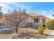 Single-story house with landscaped front yard, driveway, and desert landscaping at 2255 Potter Lake Ave, Henderson, NV 89052