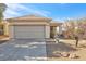 Single-story home with attached garage and desert landscaping at 2255 Potter Lake Ave, Henderson, NV 89052