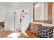 Hallway with tiled floor, wooden bench with pillows, and access to bedrooms and bath at 2255 Potter Lake Ave, Henderson, NV 89052