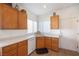 Kitchen corner sink with wood cabinets and white appliances at 2255 Potter Lake Ave, Henderson, NV 89052