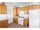 Bright kitchen area with stainless steel appliances, wooden cabinets, and a tile floor at 2255 Potter Lake Ave, Henderson, NV 89052