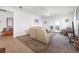 Living room with two beige leather sofas, a coffee table, and a TV at 2255 Potter Lake Ave, Henderson, NV 89052