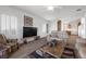 Living room with a view into the kitchen and access to patio at 2255 Potter Lake Ave, Henderson, NV 89052