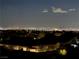 Expansive night view overlooking the city, highlighting the illuminated rooftops of nearby homes and buildings at 2255 Potter Lake Ave, Henderson, NV 89052