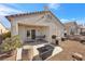 Covered patio with seating area, grill, and a wooden barrel at 2255 Potter Lake Ave, Henderson, NV 89052