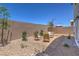 Landscaped backyard with gravel and a seating area at 2641 Snapdragon Falls Ave # 106, North Las Vegas, NV 89081