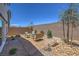 Small backyard with gravel, seating area, and desert landscaping at 2641 Snapdragon Falls Ave # 106, North Las Vegas, NV 89081