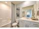 Clean bathroom with a bathtub, toilet and vanity at 2641 Snapdragon Falls Ave # 106, North Las Vegas, NV 89081