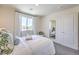 Bright bedroom with a full-size bed and a large mirror at 2641 Snapdragon Falls Ave # 106, North Las Vegas, NV 89081