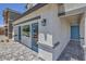 Front view of a house with blue accents and a paved walkway at 2641 Snapdragon Falls Ave # 106, North Las Vegas, NV 89081