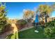 Small backyard with artificial turf and patio furniture at 2694 Kinghorn Pl, Henderson, NV 89044