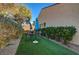 Small grassy backyard with patio furniture and umbrellas at 2694 Kinghorn Pl, Henderson, NV 89044