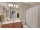 Clean bathroom with single sink vanity, shower/tub combo, and linen closet at 2694 Kinghorn Pl, Henderson, NV 89044