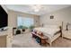 Large bedroom with king-size bed, dresser, and plenty of natural light at 2694 Kinghorn Pl, Henderson, NV 89044