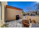 Front patio with seating, a gate, and neighborhood view at 2694 Kinghorn Pl, Henderson, NV 89044